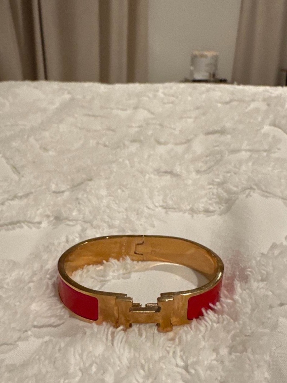 Hermes Gold Tone Bracelet with Red Accent